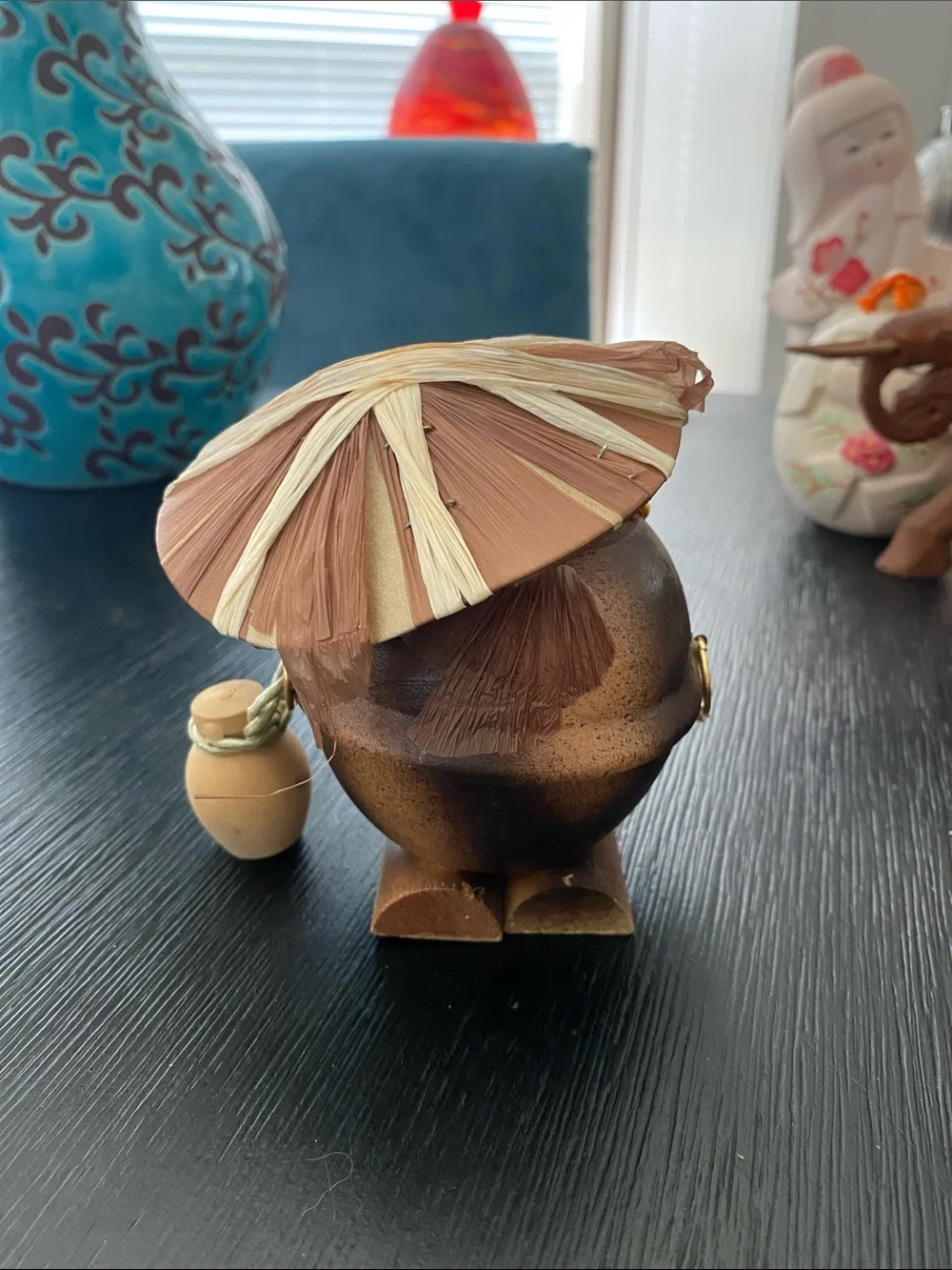 Vintage Japanese wooden folk art figurine depicts a tanuki (Japanese raccoon dog